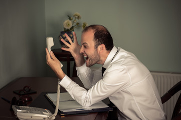 business man gesturing aggressive and shout on phone
