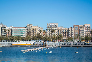 Fototapeta na wymiar BARCELONA, SPAIN - FEBRUARY 12, 2014: A view to a pier with yachts at Barcelona port, Catalonia, Spain.