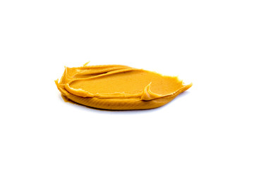 Erdnussbutter isoliert auf weiß