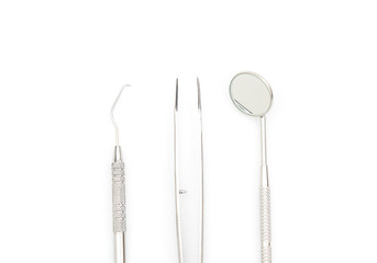 Dental tools and equipment on white background