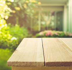 Empty wood table top on garden in morning background.For montage product display or key visual layout