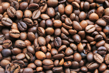 the background of the many fragrant brown roasted coffee beans