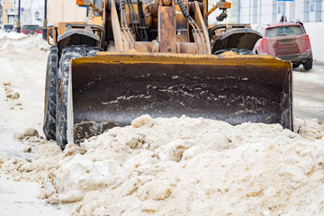 Bucket filled with snow shovel