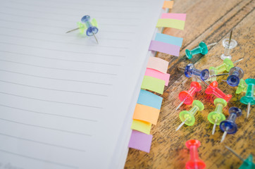 colorful pin with blank notebook