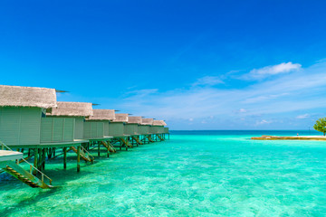 Beautiful water villas in tropical Maldives island  .