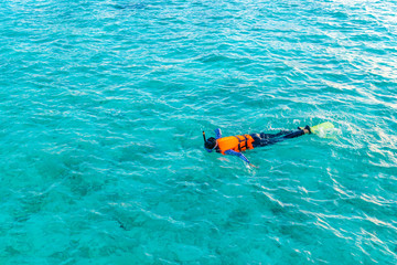 Snorkeling in tropical Maldives island .