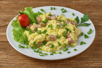 Scrambled eggs with bacon and vegetables
