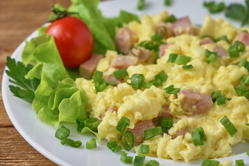 Scrambled eggs with bacon and vegetables