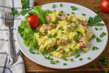 Scrambled eggs with bacon and vegetables