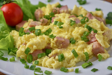 Scrambled eggs with bacon and vegetables