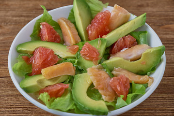 Smoked salmon salad, with greens, avocad and grapefruit.