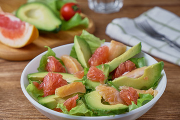 Smoked salmon salad, with greens, avocad and grapefruit.