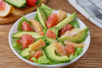Smoked salmon salad, with greens, avocad and grapefruit.