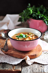 Delicious organic soup with chicken, beans, onions, tomatoes, mushrooms and parsley.