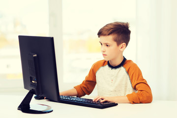 boy with computer at home
