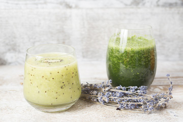 Healthy kiwi smoothie in glass with slice of kiwi and spinach  smoothie.