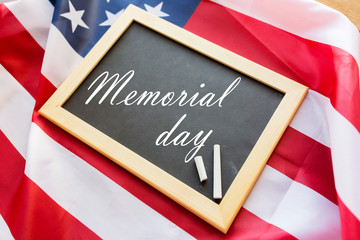memorial day words on chalkboard and american flag