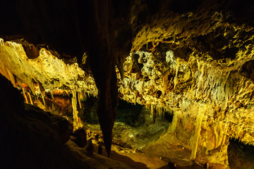 underground cave illuminated by colorful light