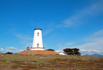 Fototapeta na wymiar Lighthouse at Piedras Blancas point on the Central California Coast north of San Simeon elephant seal colony in California USA