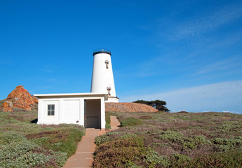 Fototapeta na wymiar Lighthouse at Piedras Blancas point on the Central California Coast north of San Simeon California U S of A