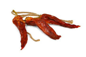 Dried beans of red pepper on white background
