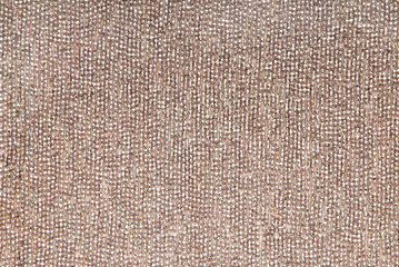 creative background, golden fabric with beads