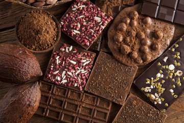 Dark and milk chocolate bar on a wooden table