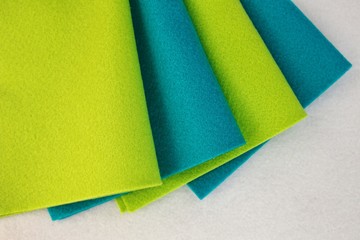 Green and blue felt set for background.