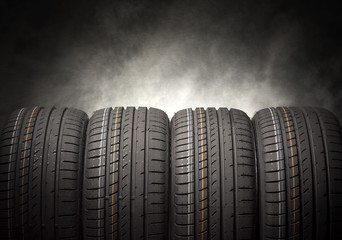 Fototapeta premium Car tires on a dark background.