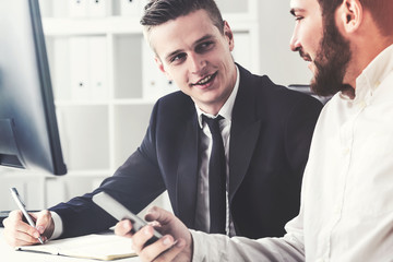 Close up of two business partrners