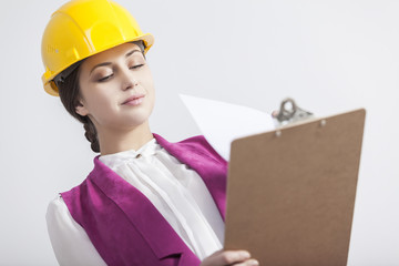 Serious woman architect in pink and yellow