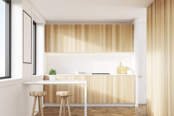 Light wood kitchen interior with a table