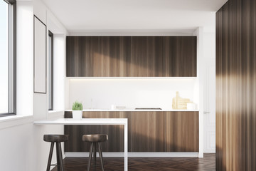 Dark wood kitchen interior with a table