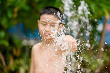 Boy and fountain water