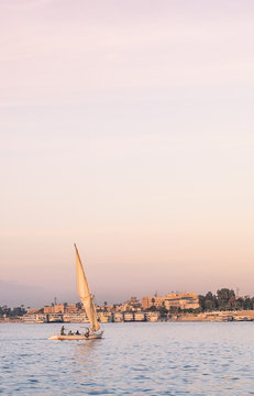 Landscape of Luxor with sailboat on Nile - river cruise on felucca.