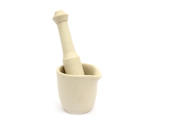 Traditional porcelain mortar and pestle, used to grind spices, on white background