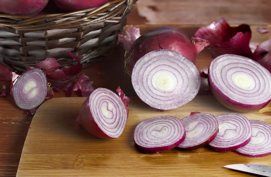 Onion salad, red is a close-up on a wooden board