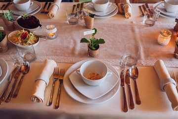 Decorated table arrangement in restaurant with dishes