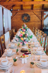 Decorated table arrangement in restaurant with dishes