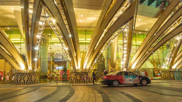 golden illumination macau famous hotel entrance traffic panorama 4k time lapse china
