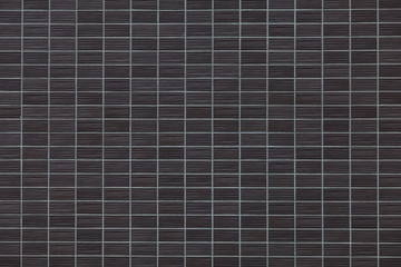 Black brick tile wall background seamless and texture