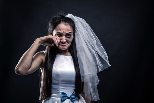 Bride with tearful face, unhappy marriage