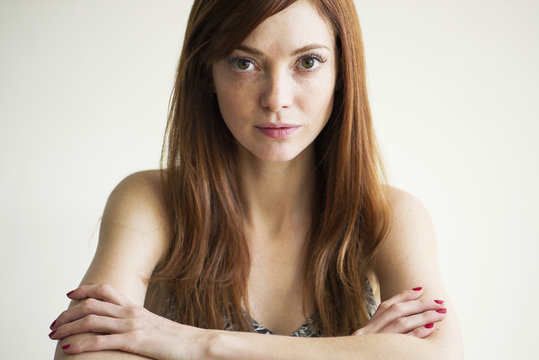 Woman with arms folded, portrait