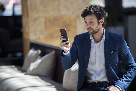 Man using multimedia smartphone