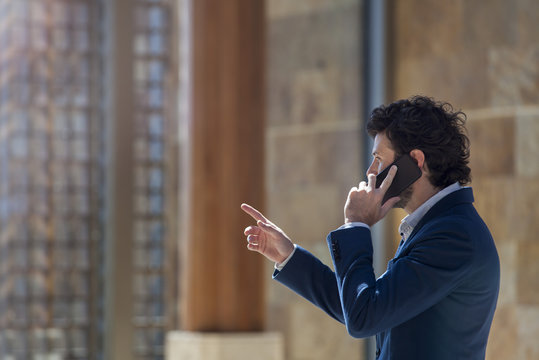 Businessman negotiating on cell phone
