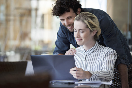 Couple using laptop computer together
