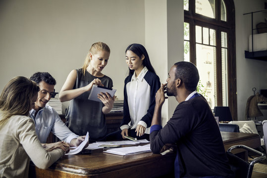 Colleagues collaborating in casual office
