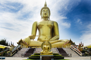 Thai people and travelers foreigner visit and pray golden biggest Shakyamuni buddha statue at Wat Muang temple