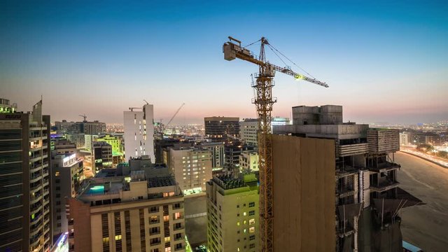 dubai night sunset night rooftop construction crane panorama 4k time lapse uae
