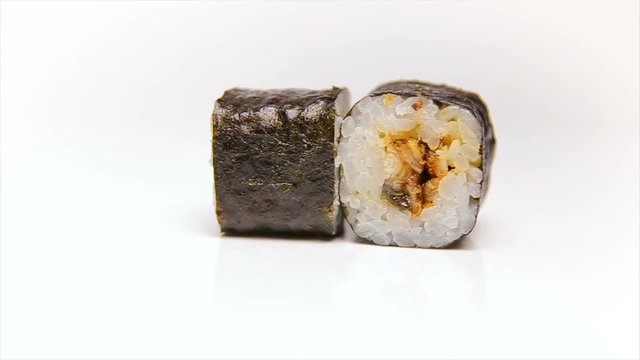Unagi maki sushi roll with smoked Eel on white background rotating (loop)